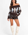 Chloe Off Shoulder Sweater worn by model with brown argyle knit and leather shorts
