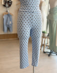 A mannequin styled with dusty blue polka dot Capri legging.