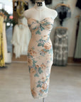 Floral dress on a mannequin in a clothing store setting