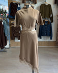 Elsie Midi Dress on mannequin showing brown satin asymmetrical hem and lace waist