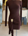 Brown dress with a gold belt on a mannequin in a store setting