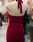 Red dress on a mannequin in a store setting